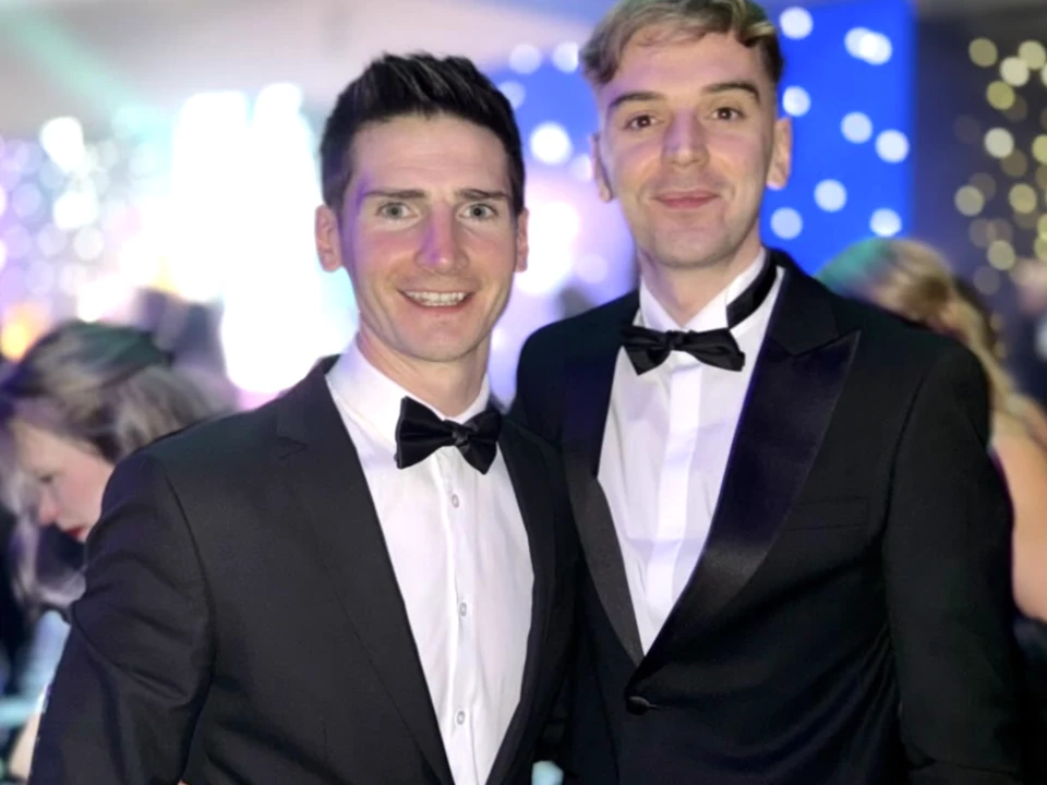 Two team members at an industry awards night