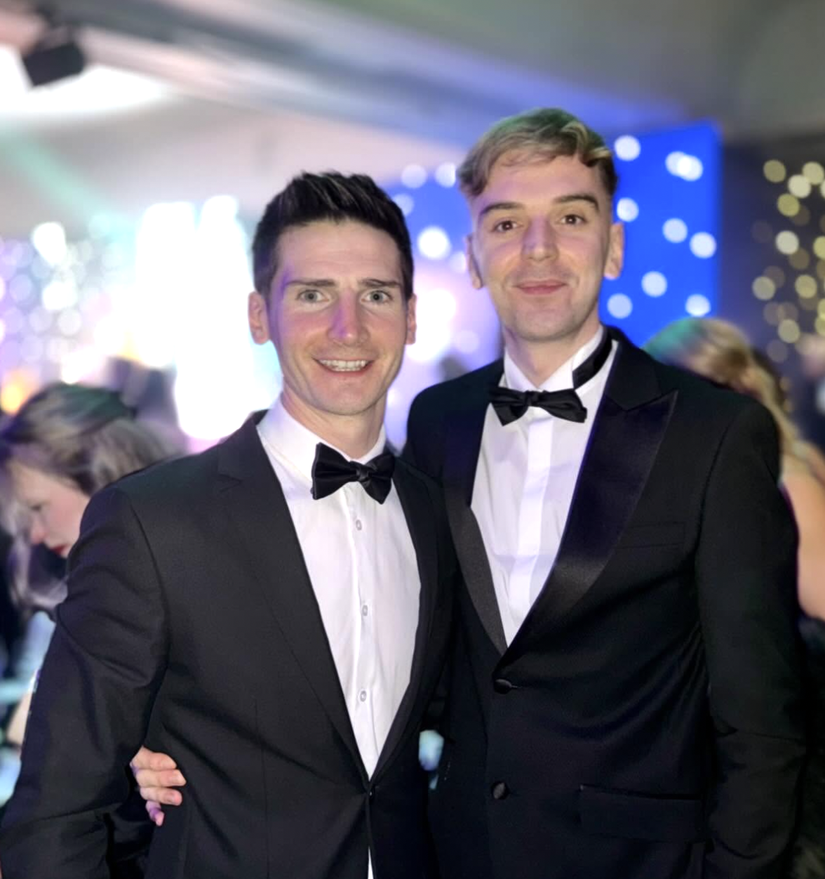 Two team members at an industry awards night