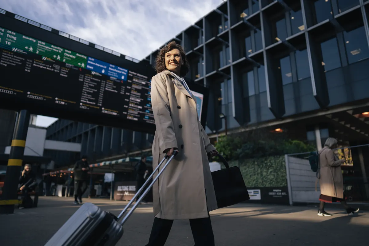 Traveller with suitcase at a station during the Caledonian Sleeper production